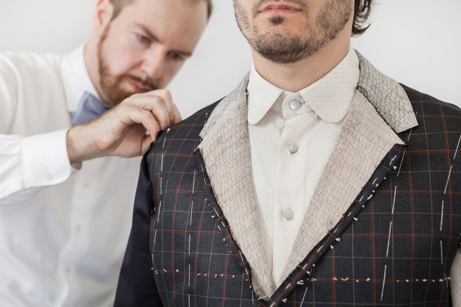 Second fitting of a bespoke suit Bespoke tailor Egon Brandstetter during second fitting