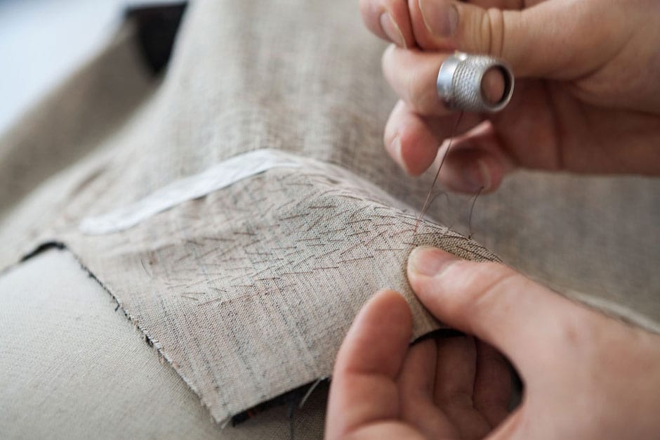 Pad stitching the lapel Padding the horse hair of a bespoke suit