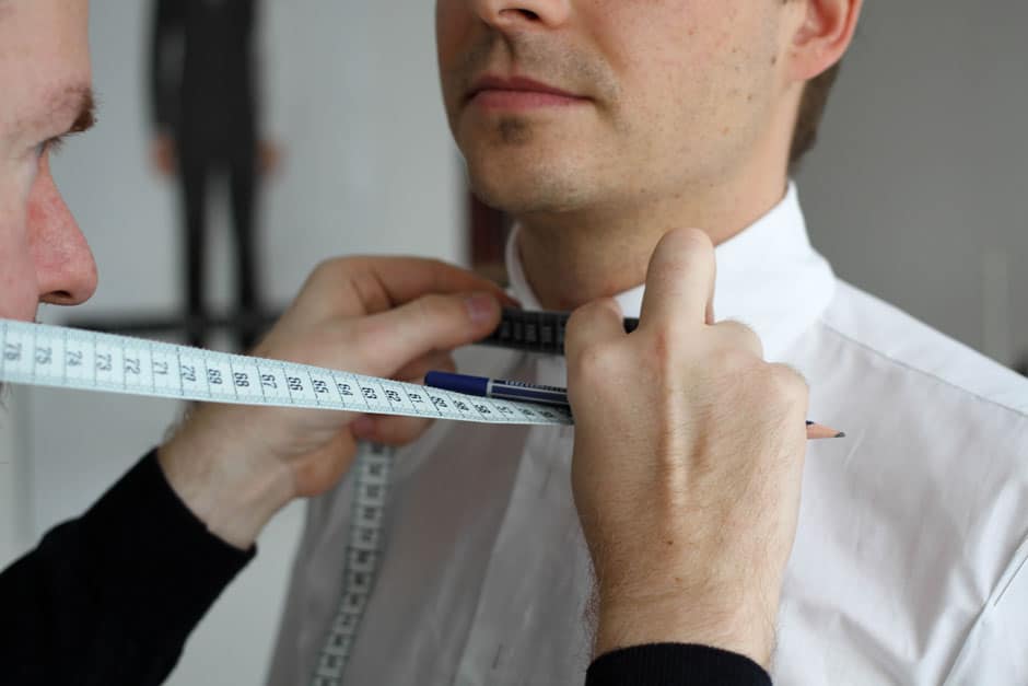 Taking measurements for a bespoke dress shirt Bespoke tailor Egon Brandstetter taking measurements for a custom dress shirt